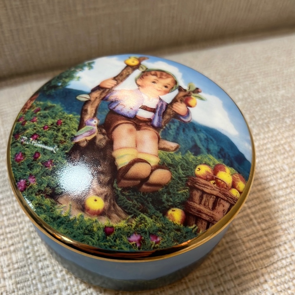 M.I. Hummel. “Apple Tree Boy” from the MI Hummel music box collection.